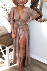 Vestido largo tipo murciélago con cintura con cordón y botones